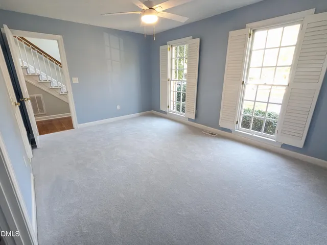 a bathroom with a painting on the wall and a shower