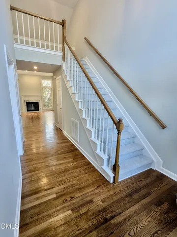 a view of an entryway with wooden floor