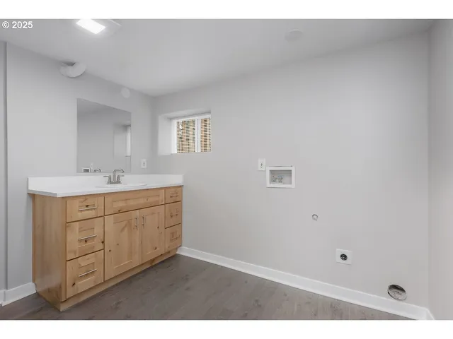 a bathroom with a sink vanity and a mirror