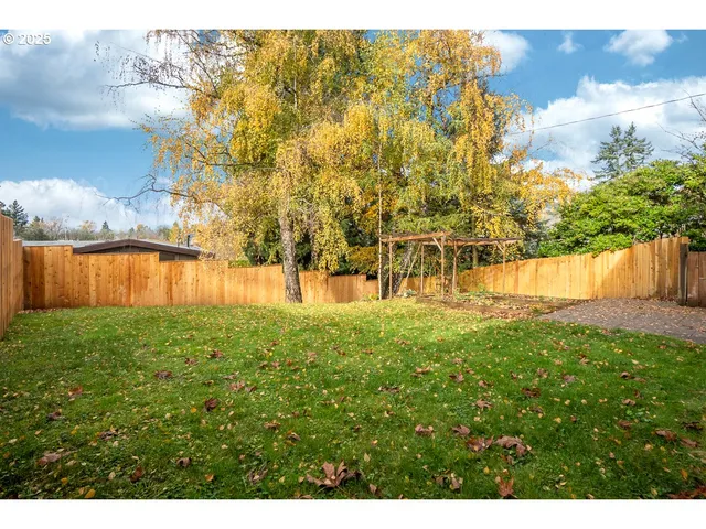 a view of a yard with an outdoor space