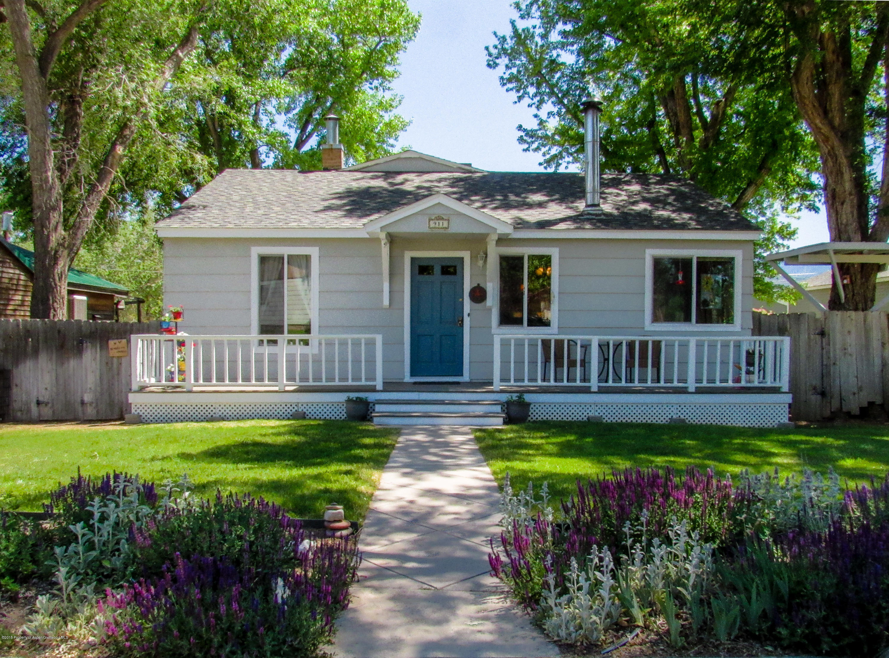 911 West 3rd Street Rifle, CO 81650 - Photo 1 of 29 a view of a house with a yard and plants