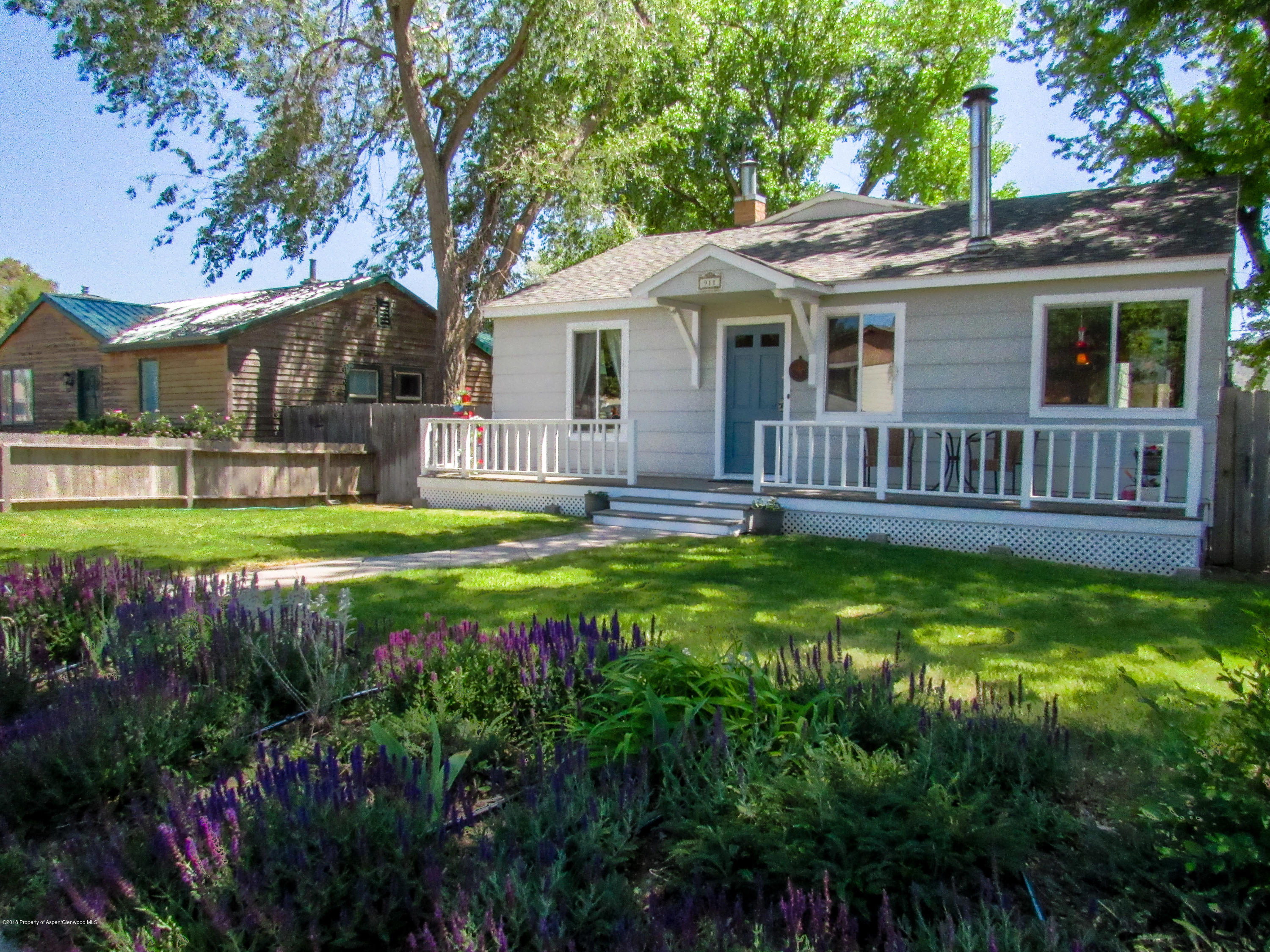 911 West 3rd Street Rifle, CO 81650 - Photo 2 of 29 a view of a house with a yard porch and sitting area