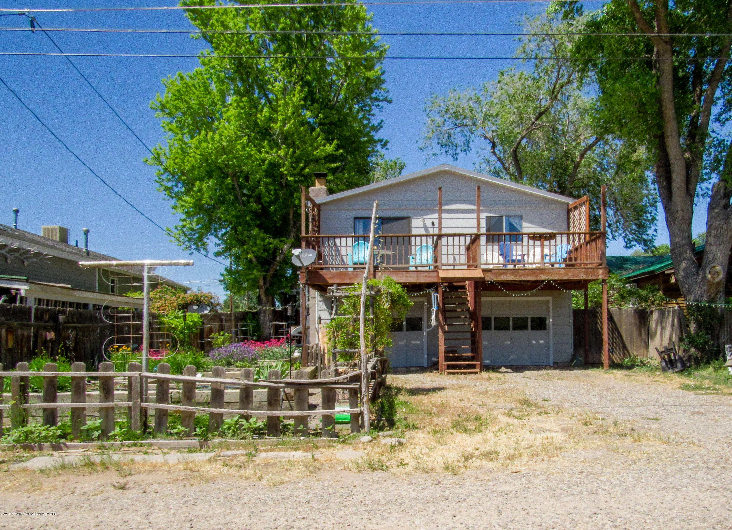 911 West 3rd Street Rifle, CO 81650 - Photo 21 of 29 a front view of a house with a yard