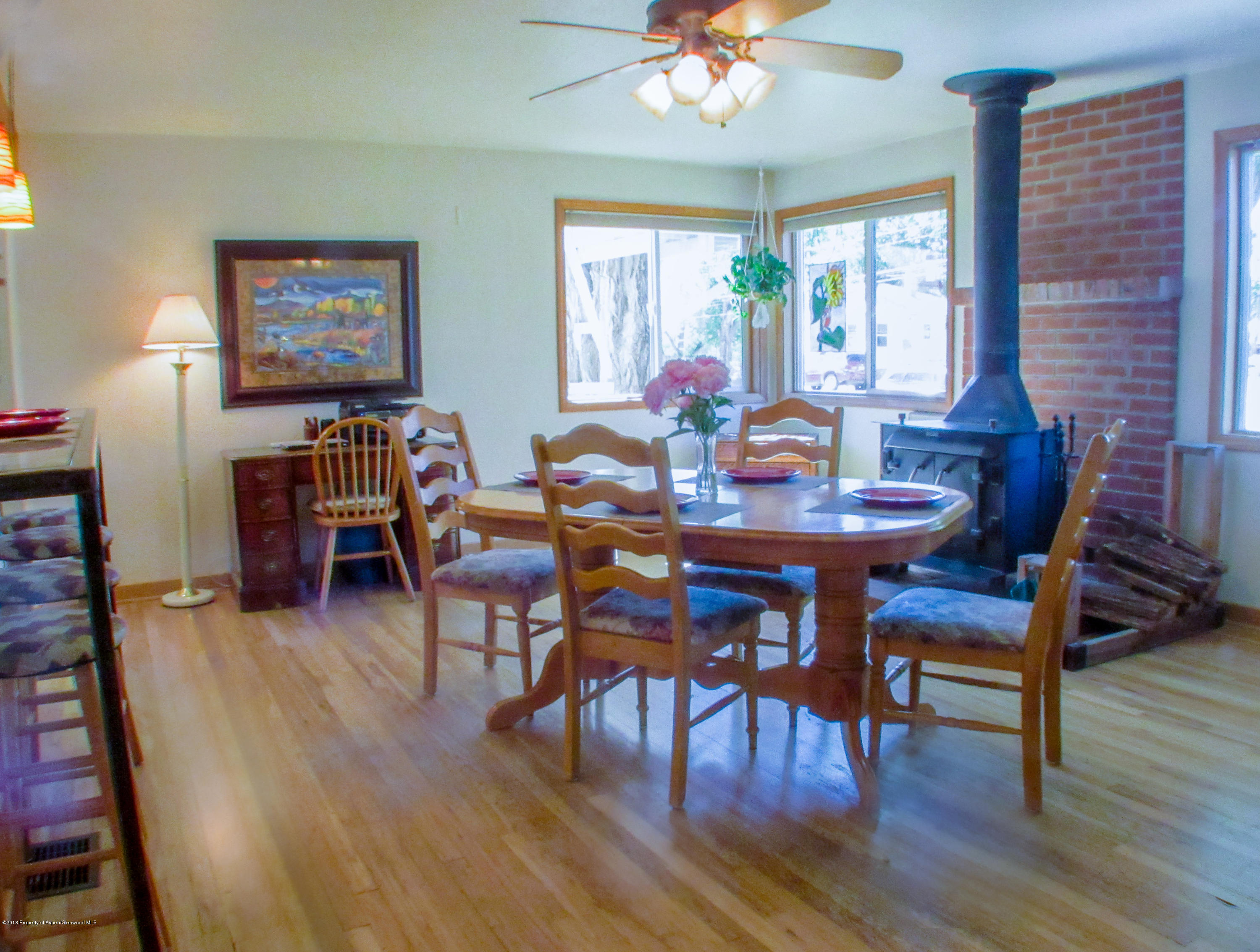 911 West 3rd Street Rifle, CO 81650 - Photo 4 of 29 a view of a dining room with furniture window and wooden floor