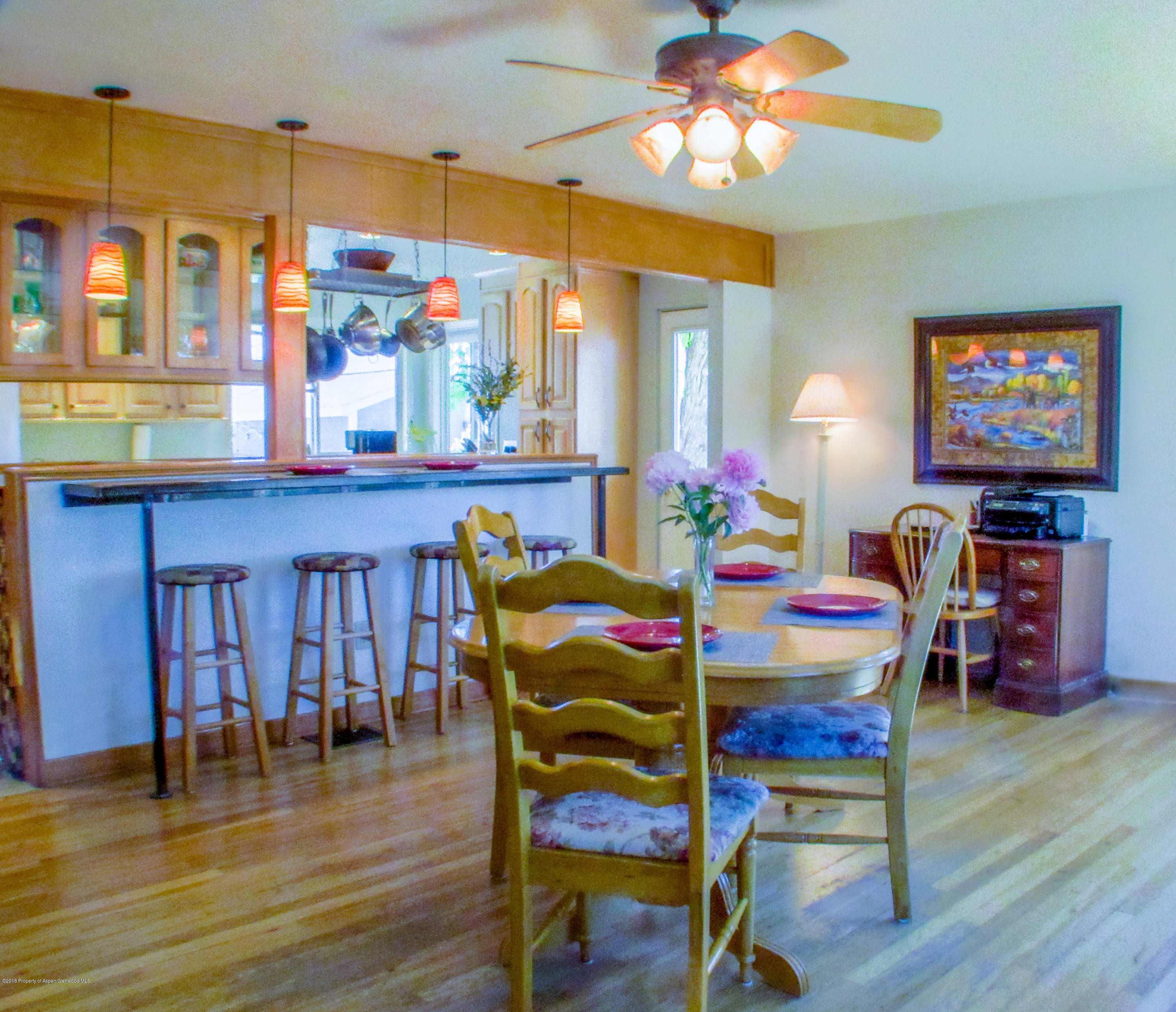 911 West 3rd Street Rifle, CO 81650 - Photo 5 of 29 a view of a dining room with furniture and wooden floor
