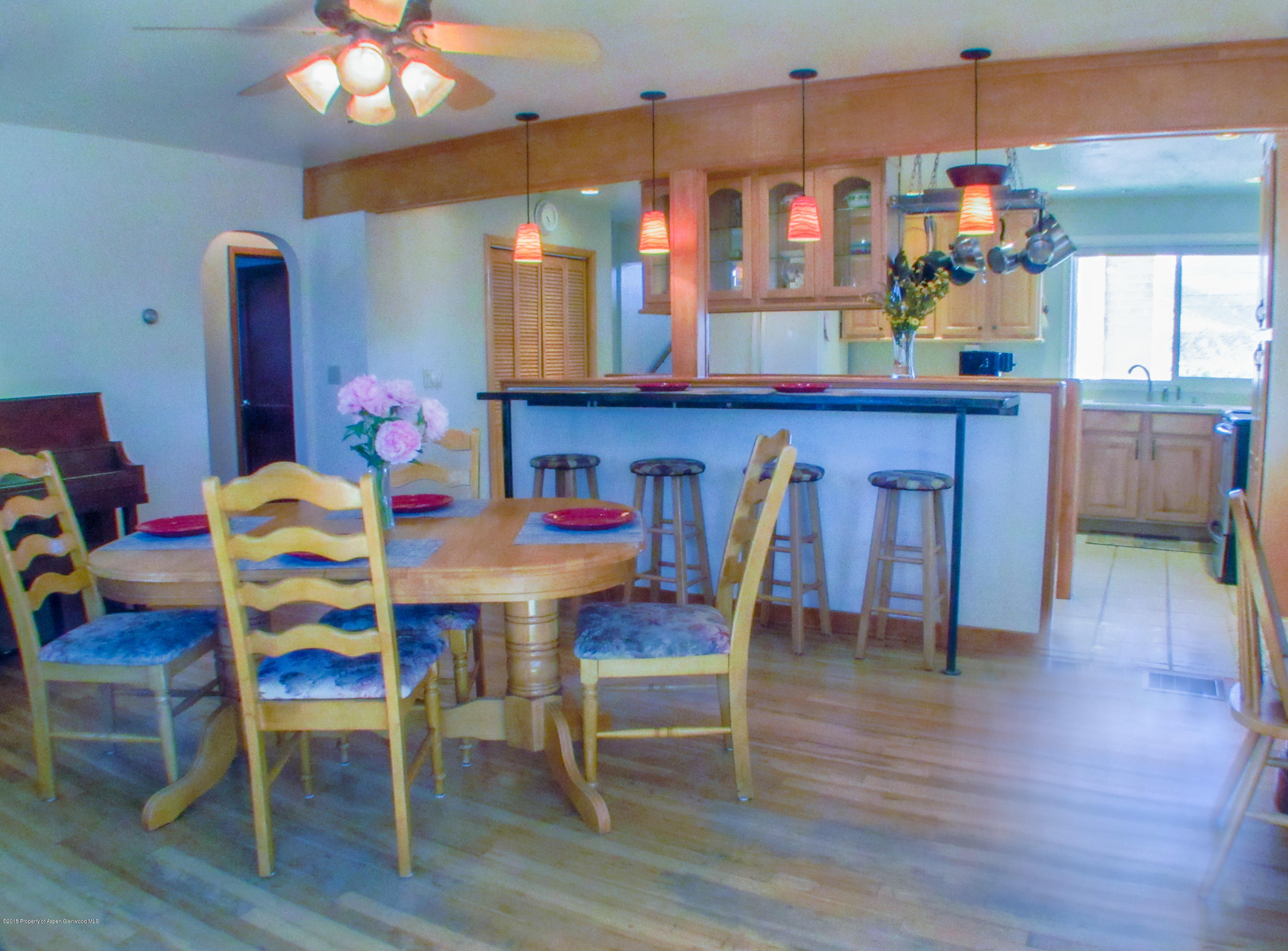 911 West 3rd Street Rifle, CO 81650 - Photo 6 of 29 a dining room with furniture and wooden floor