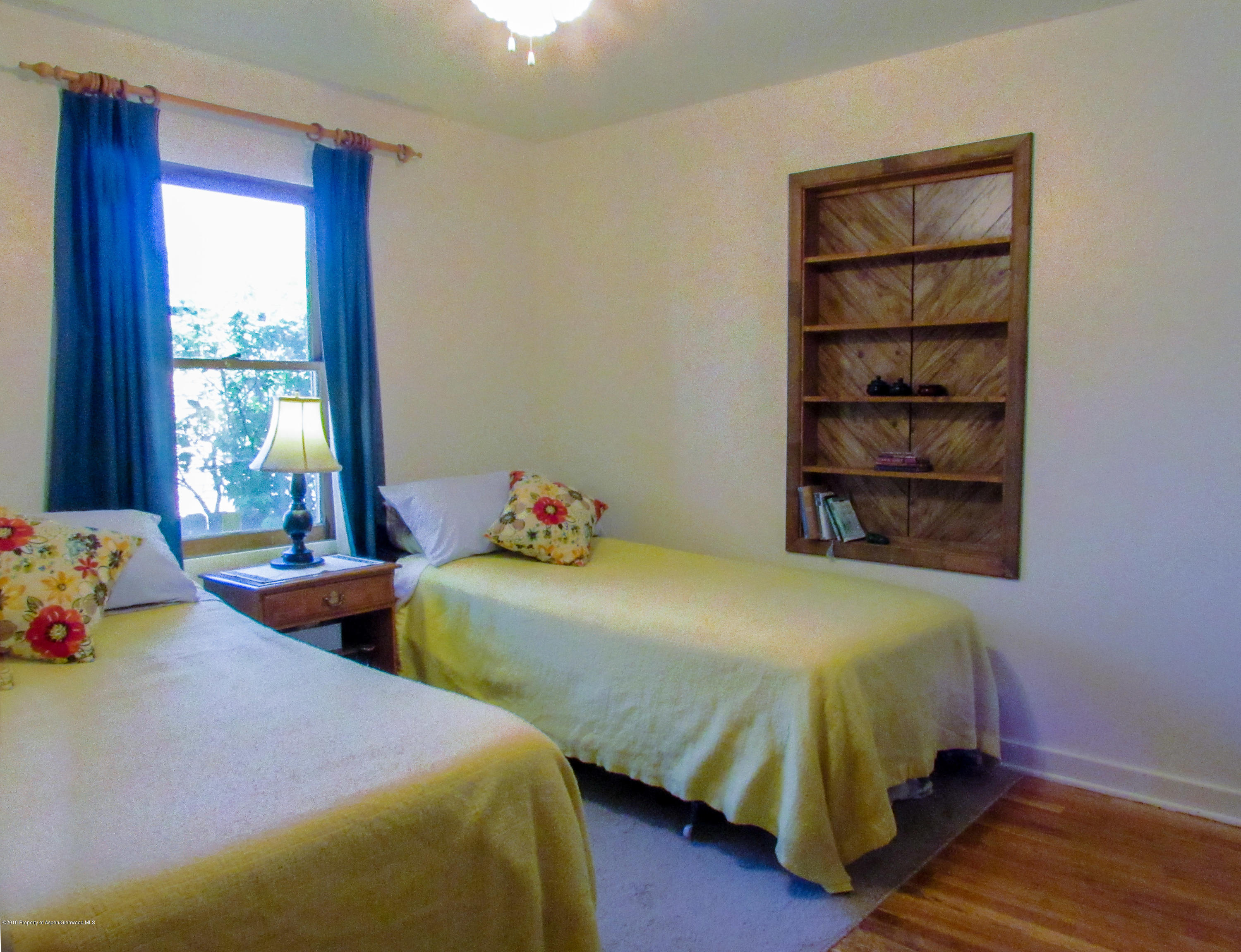 911 West 3rd Street Rifle, CO 81650 - Photo 10 of 29 a bedroom with two beds and a window
