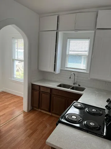 a kitchen that has a sink and a stove
