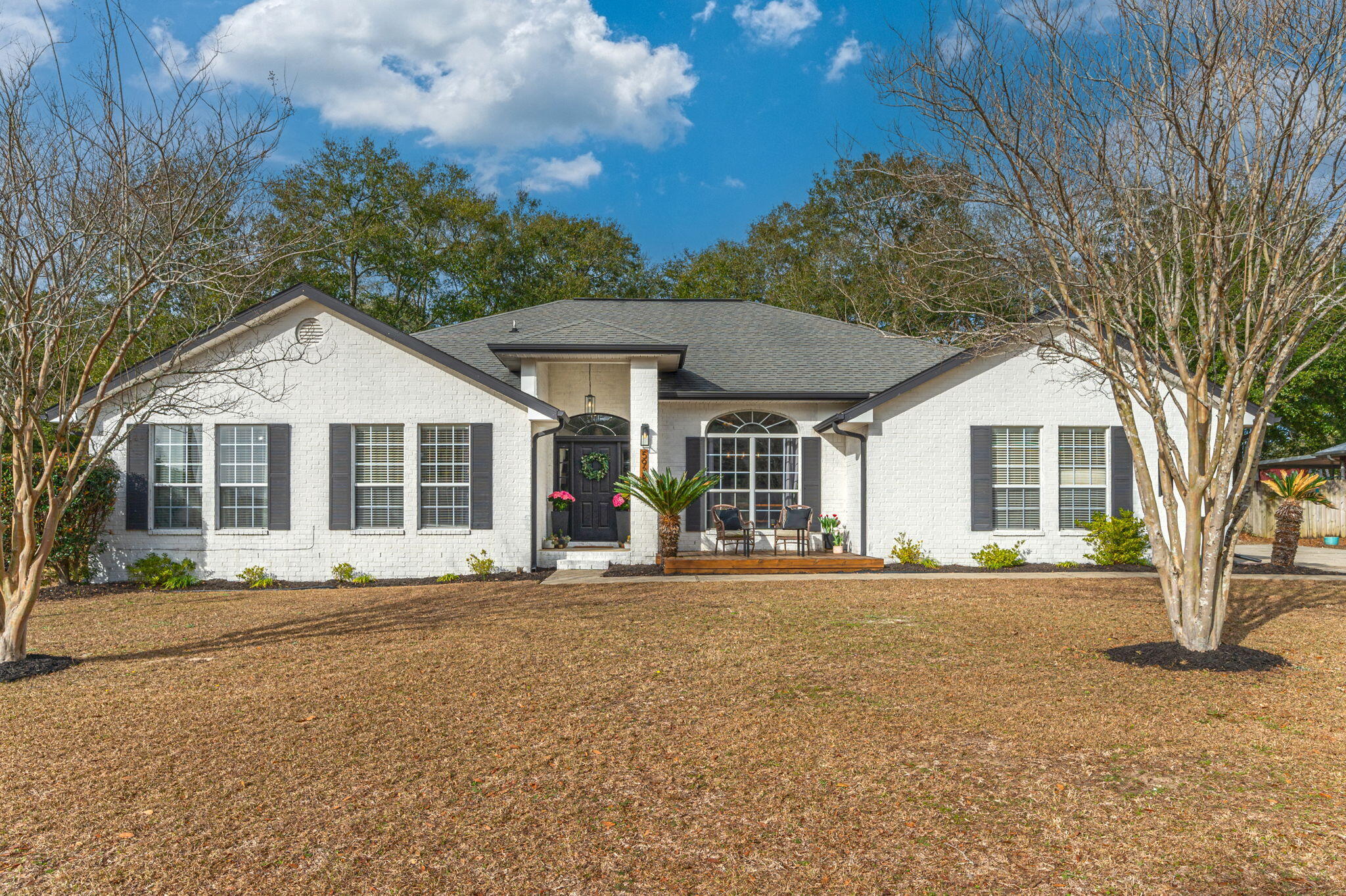 a front view of a house with a yard