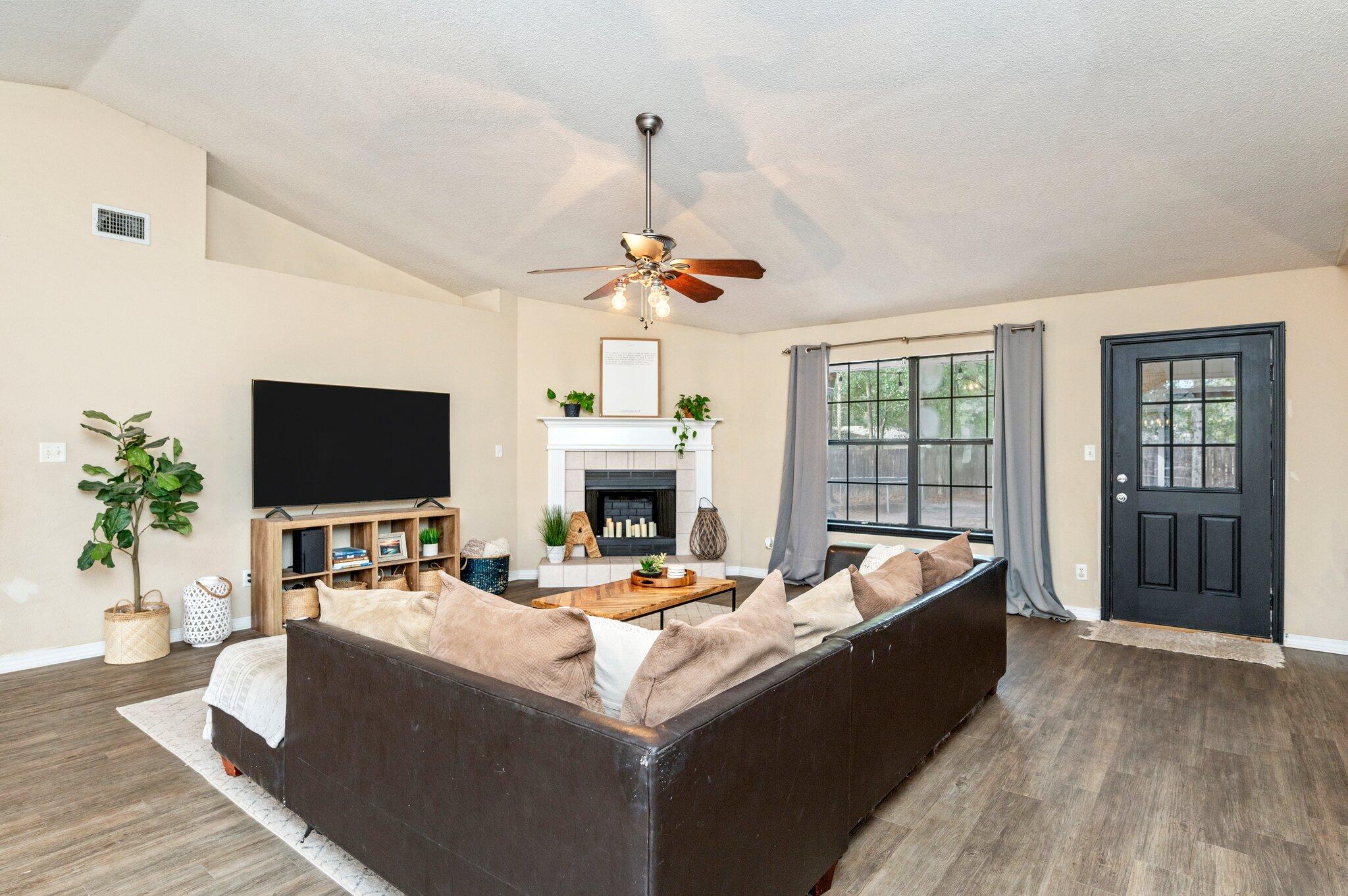 5938 Ridgeview Drive Milton, FL 32570 - Photo 12 of 58 a living room with fireplace furniture and a flat screen tv