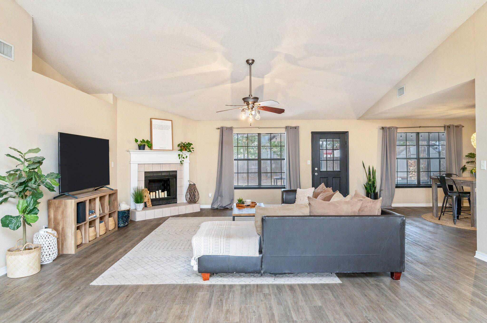 5938 Ridgeview Drive Milton, FL 32570 - Photo 13 of 58 a living room with fireplace furniture and a flat screen tv