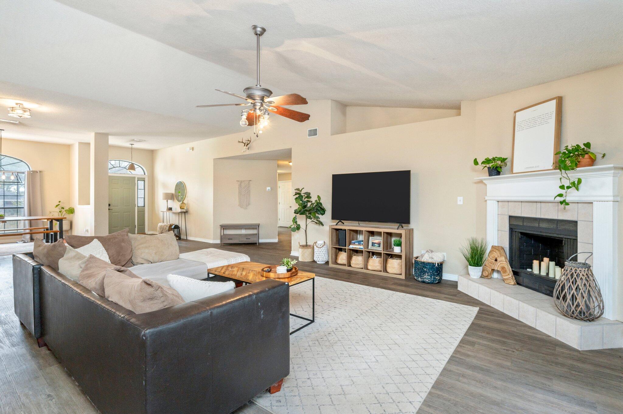 5938 Ridgeview Drive Milton, FL 32570 - Photo 14 of 58 a living room with furniture and a fireplace