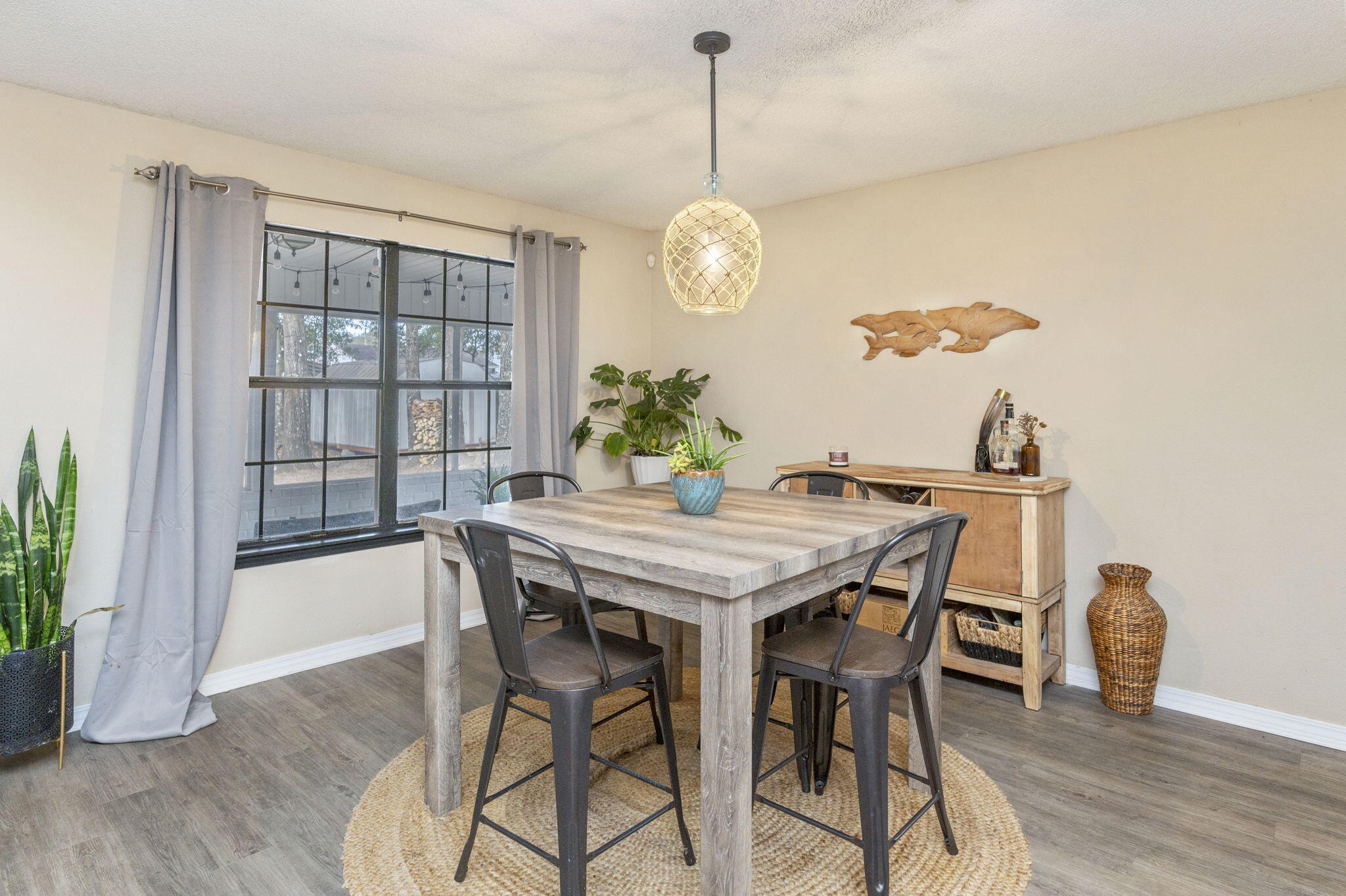 5938 Ridgeview Drive Milton, FL 32570 - Photo 16 of 58 a view of a dining room with furniture window and wooden floor