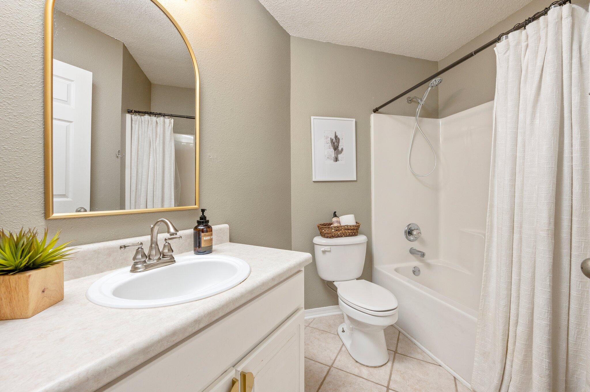 5938 Ridgeview Drive Milton, FL 32570 - Photo 39 of 58 a bathroom with a sink toilet and shower