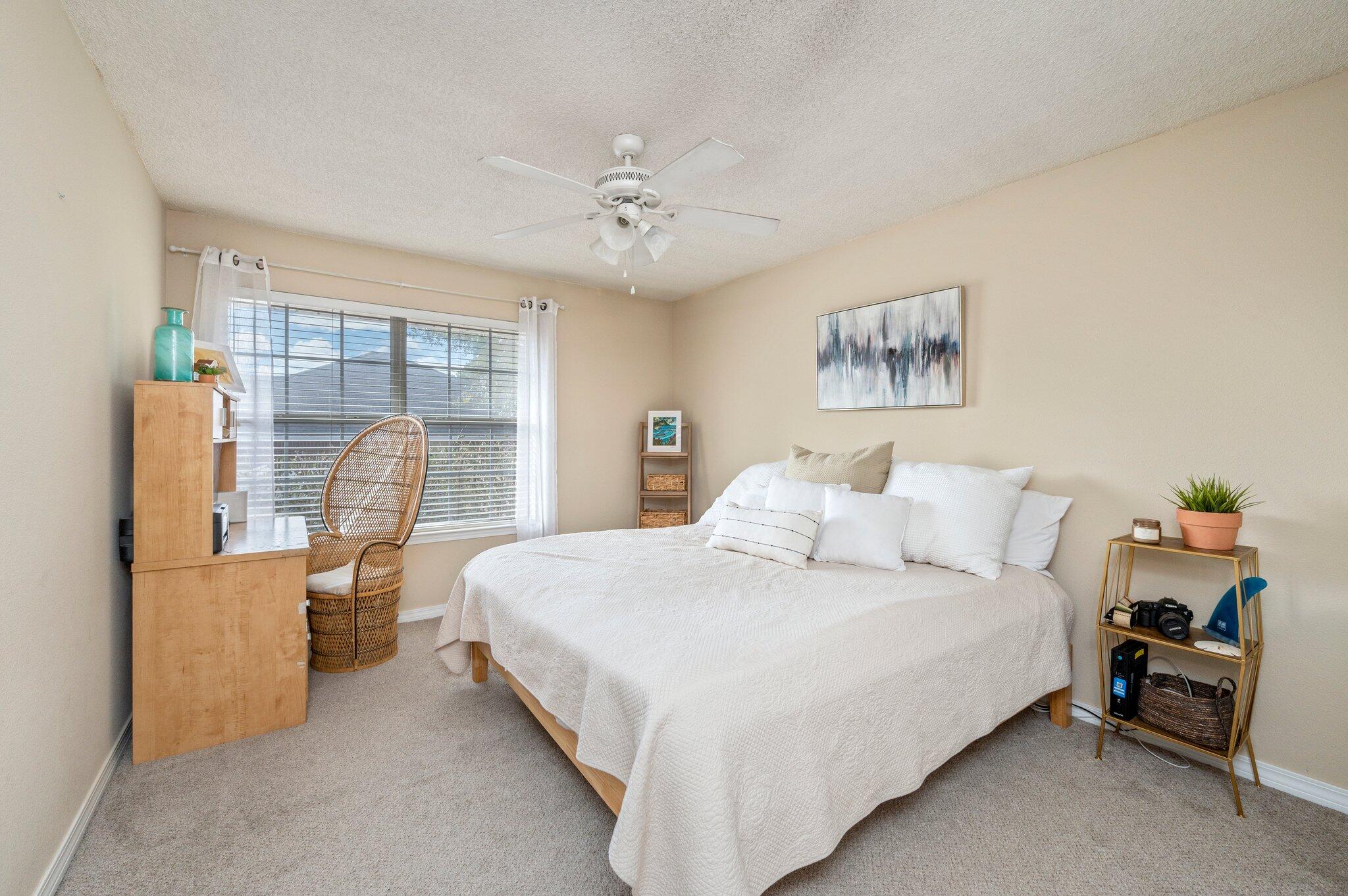 5938 Ridgeview Drive Milton, FL 32570 - Photo 40 of 58 a bedroom with a bed and a large mirror