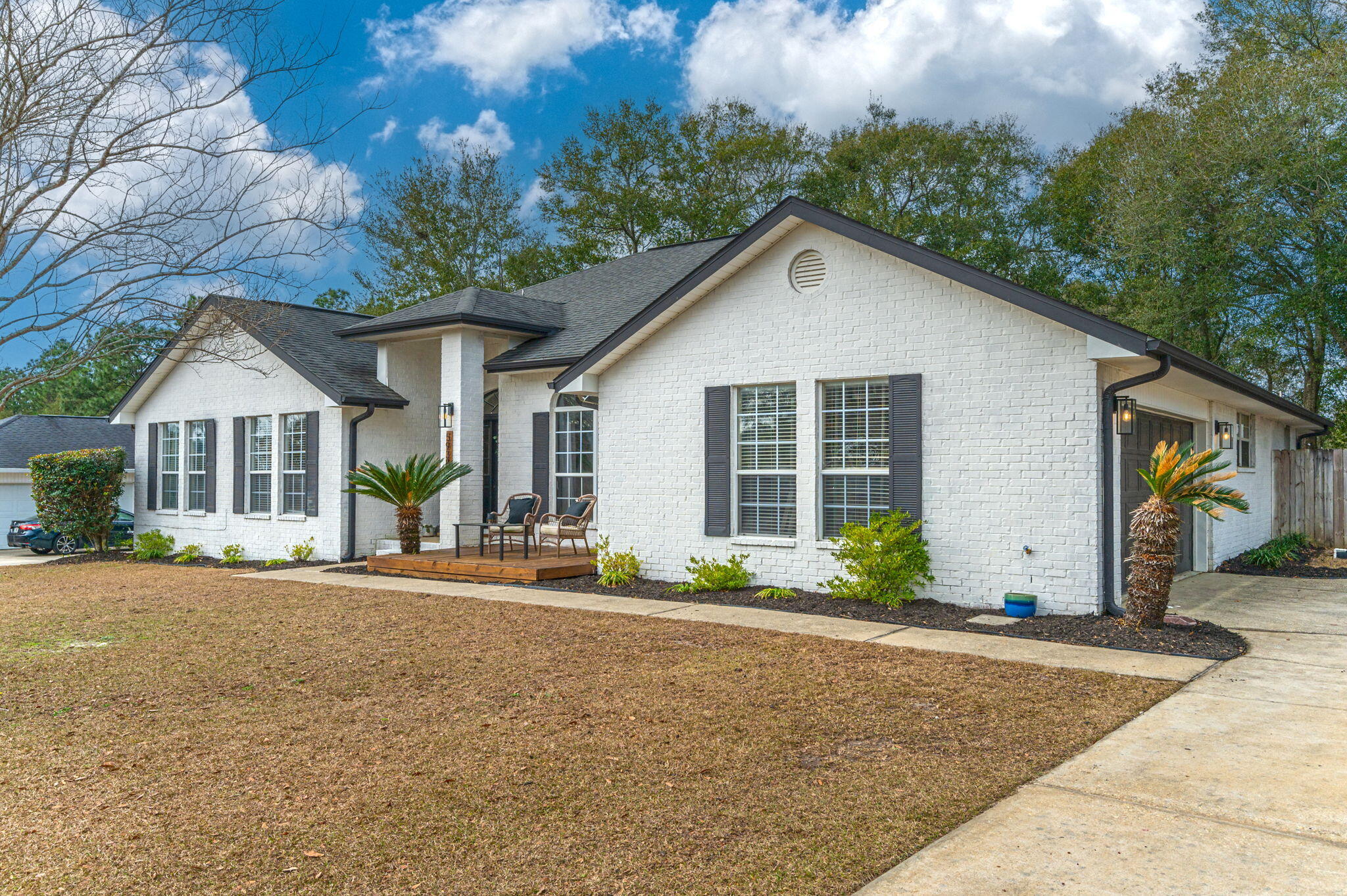 5938 Ridgeview Drive Milton, FL 32570 - Photo 4 of 58 a front view of a house with a yard and garage