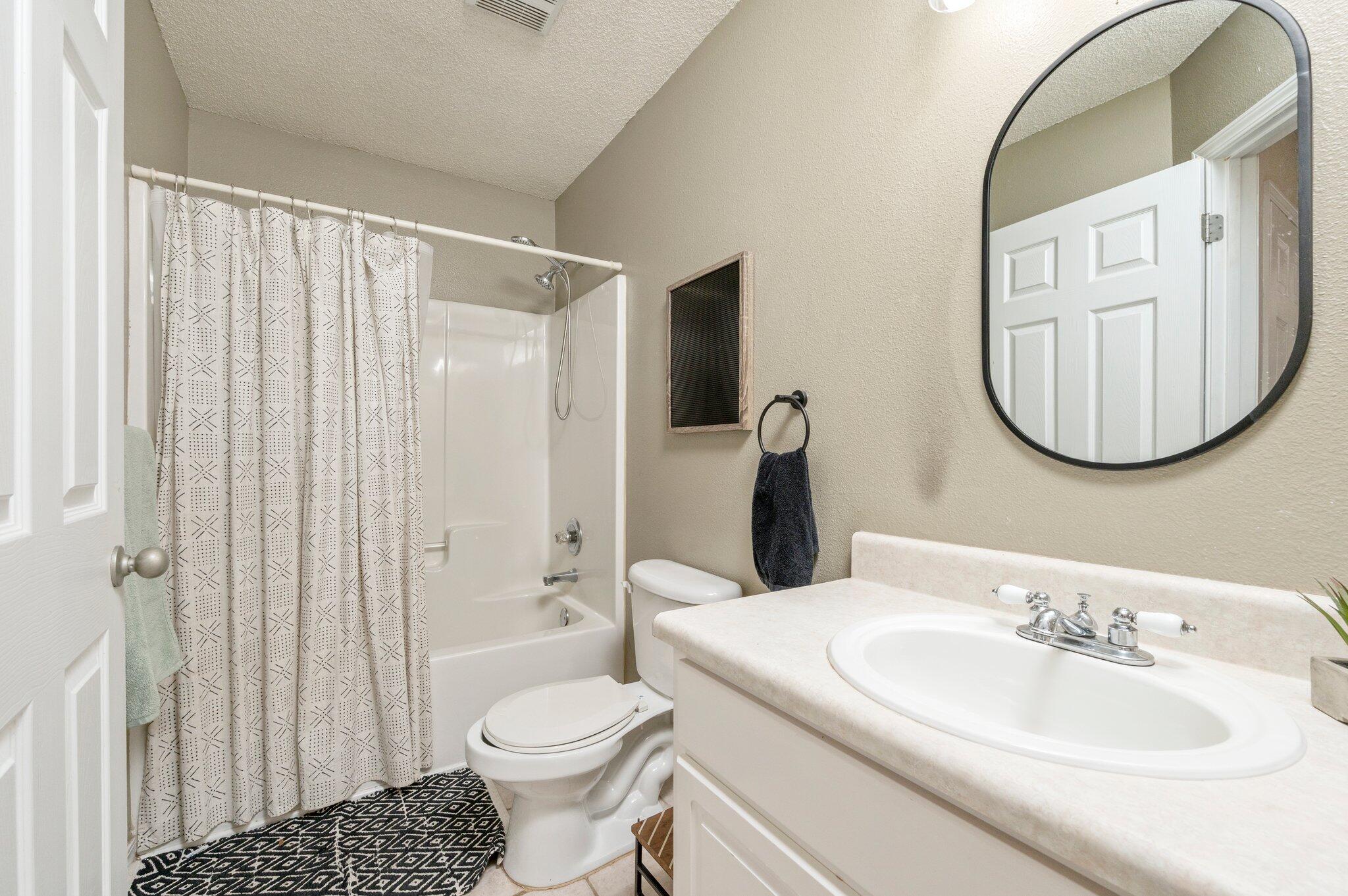 5938 Ridgeview Drive Milton, FL 32570 - Photo 42 of 58 a bathroom with a sink toilet and shower