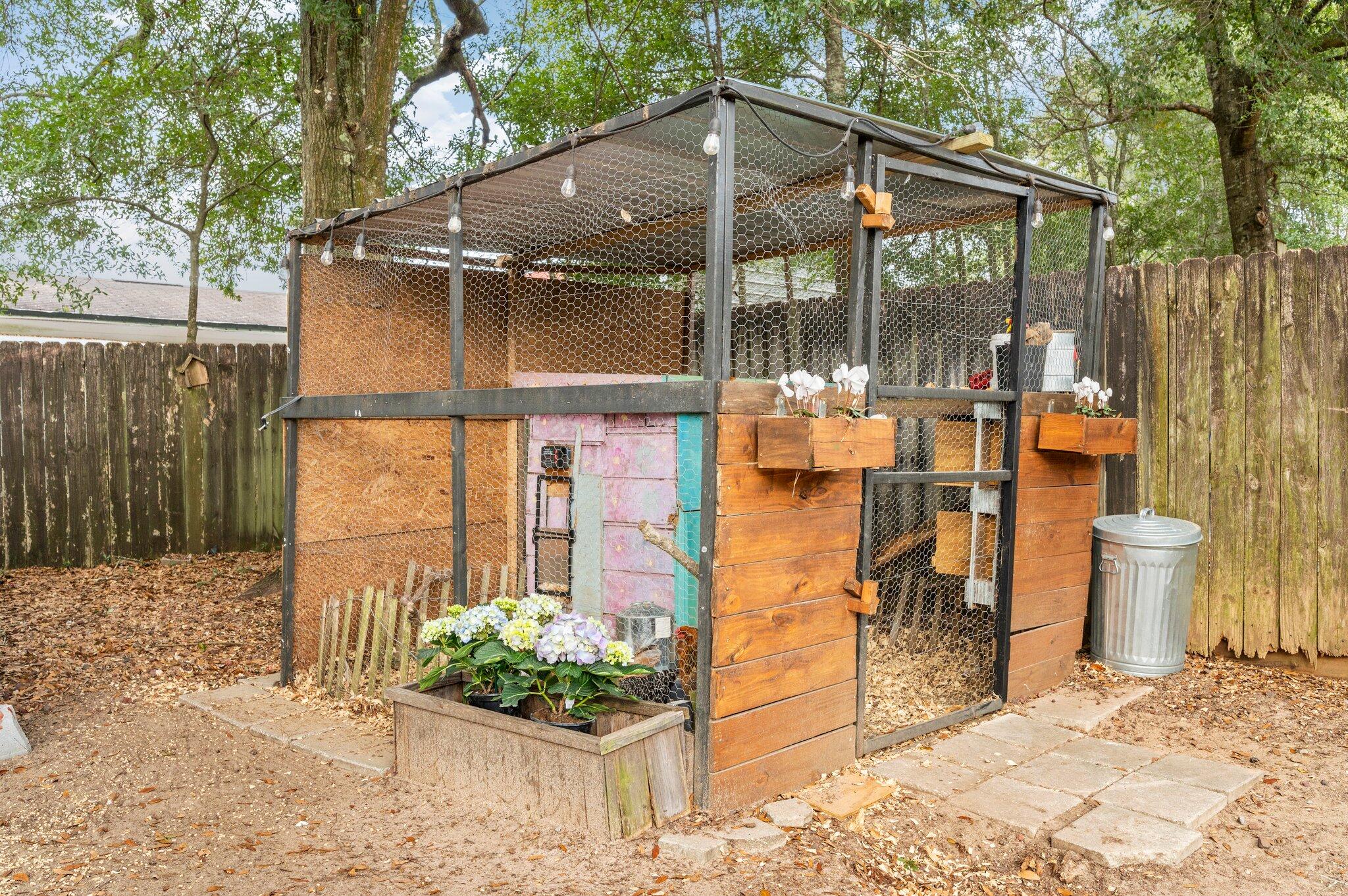 5938 Ridgeview Drive Milton, FL 32570 - Photo 43 of 58 a backyard of a house with seating space