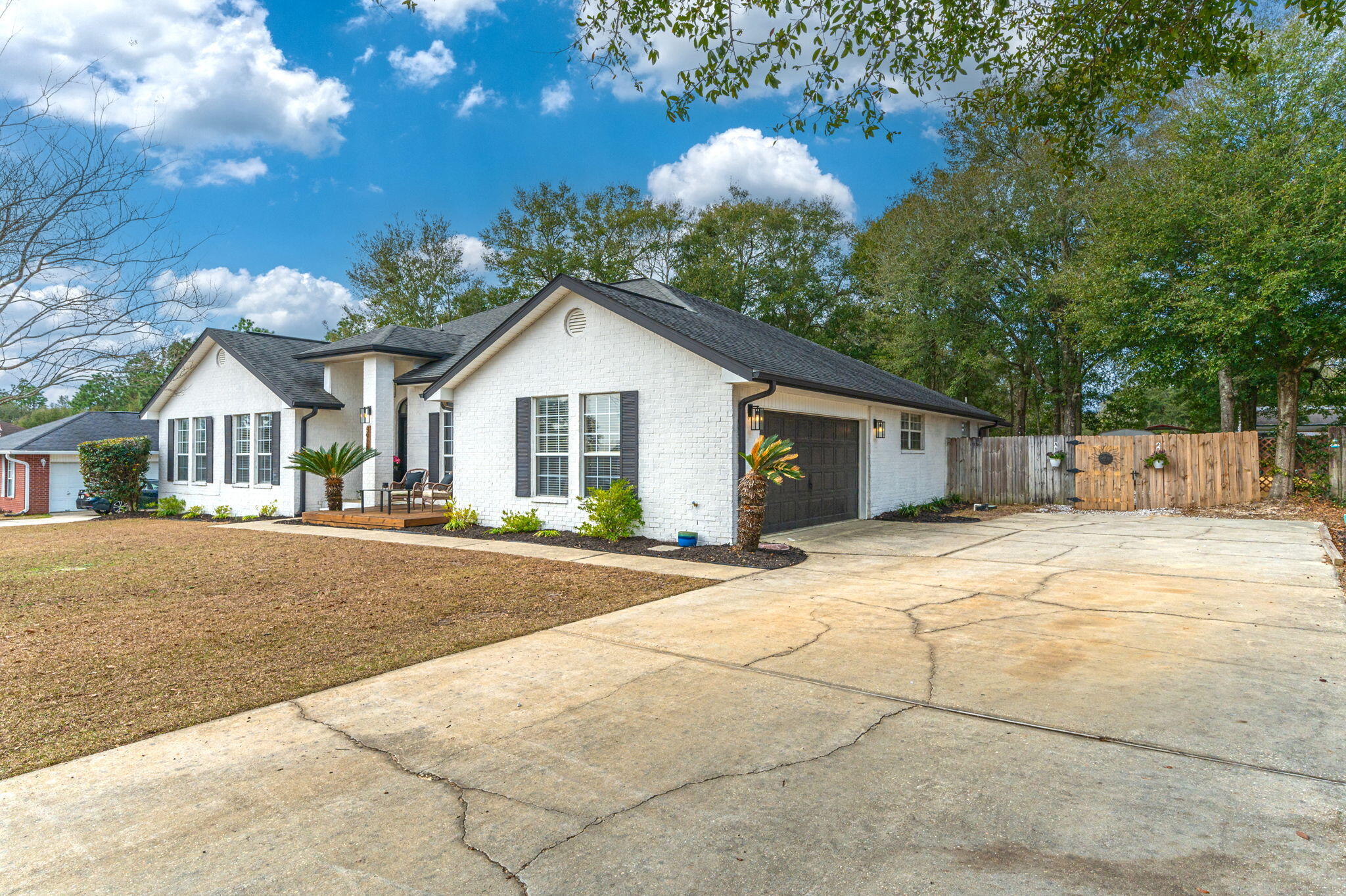 5938 Ridgeview Drive Milton, FL 32570 - Photo 5 of 58 a view of a house with a yard and large tree