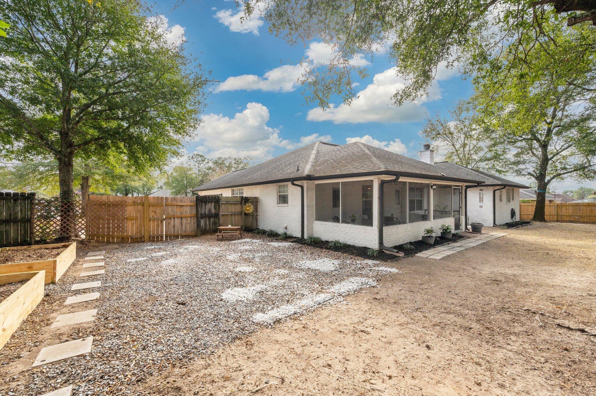 5938 Ridgeview Drive Milton, FL 32570 - Photo 51 of 58 a view of a house with a yard