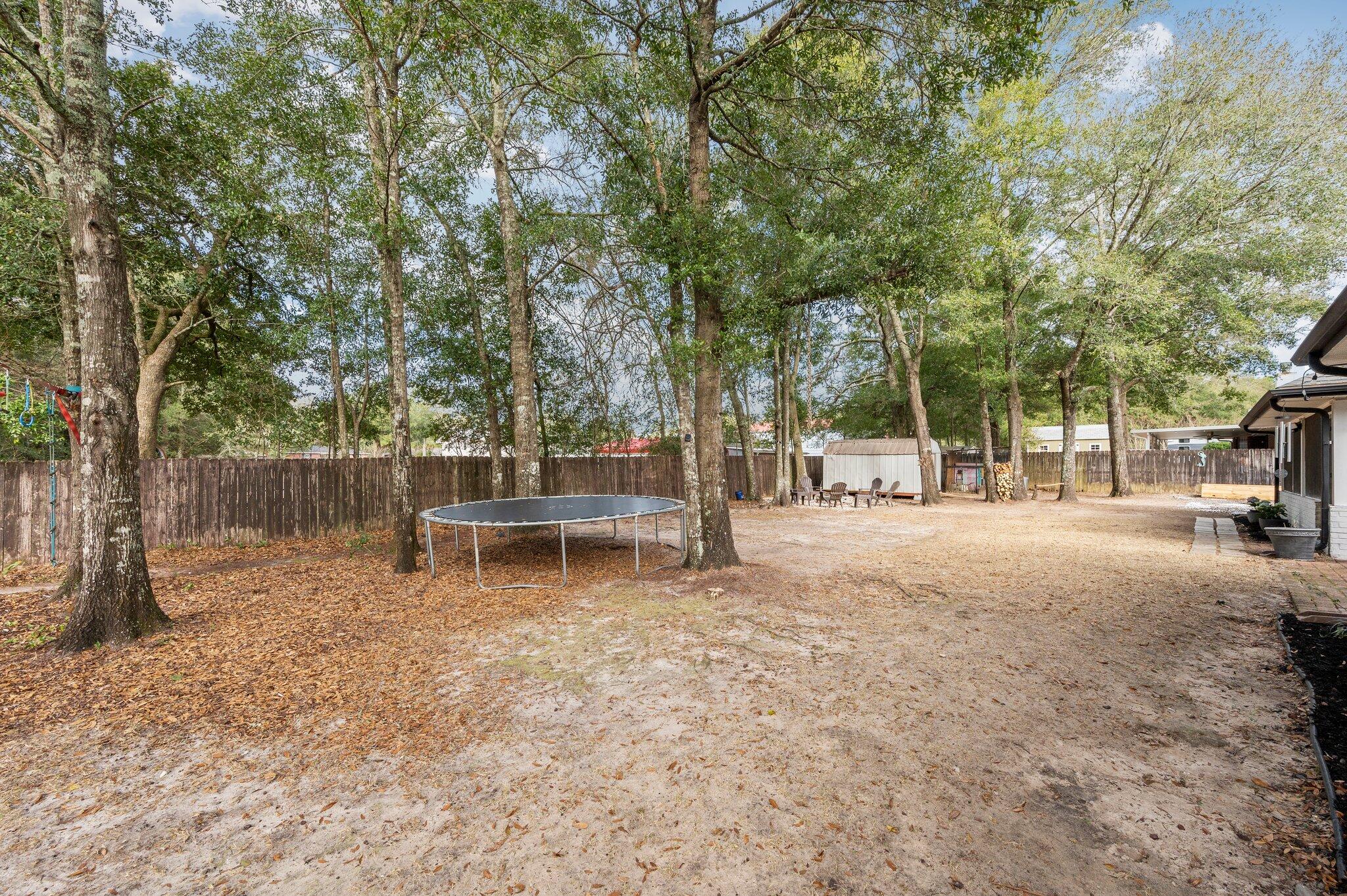 5938 Ridgeview Drive Milton, FL 32570 - Photo 53 of 58 a view of backyard with sitting area