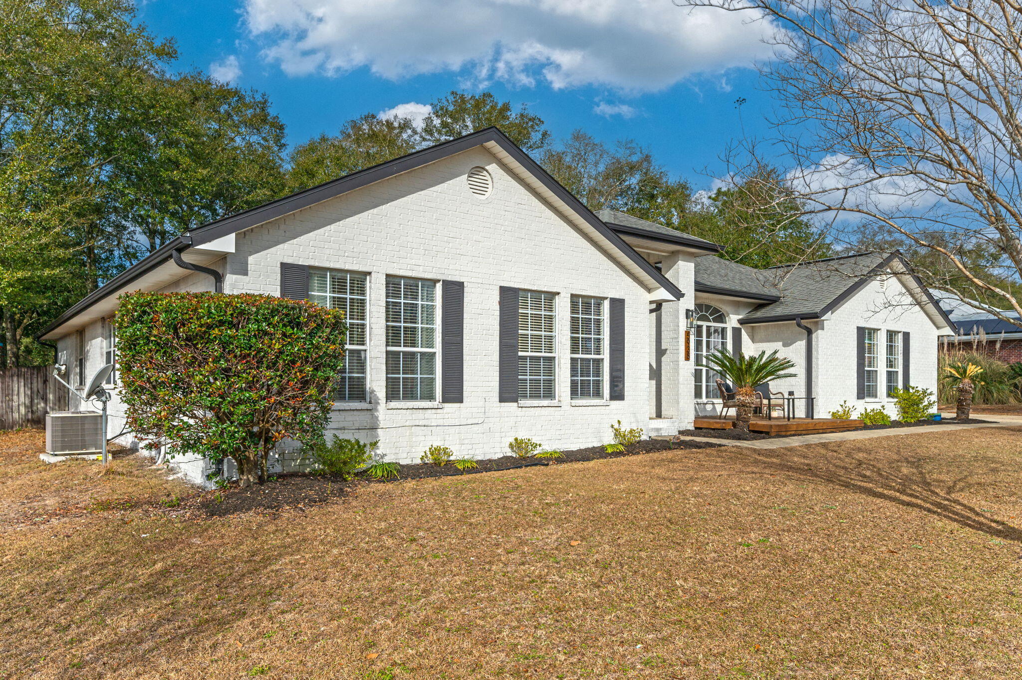 5938 Ridgeview Drive Milton, FL 32570 - Photo 57 of 58 a front view of a house with a garden