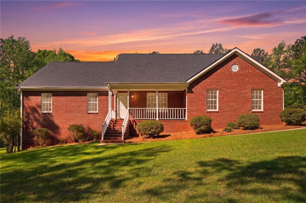 314 Coady Road Jackson, GA 30233 - Photo 1 of 31 a front view of a house with a yard and entertaining space