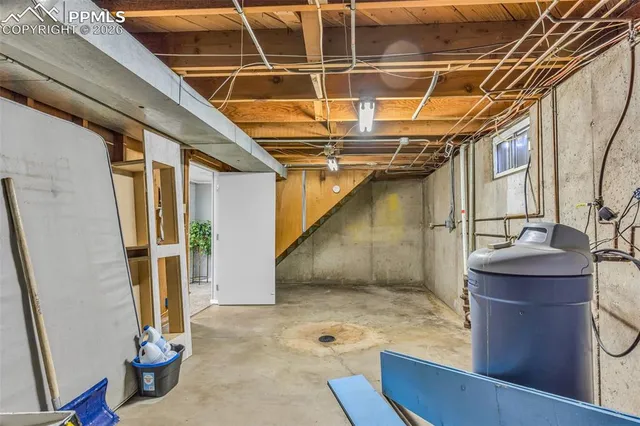 a dining room with furniture and a floor to ceiling window