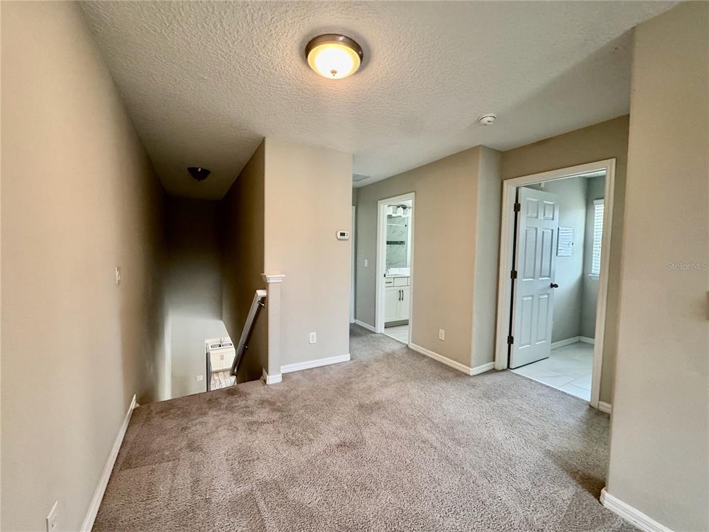 8620 Wellington Blue Lane Windermere, FL 34786 - Photo 15 of 22 an empty room with fan and entrance