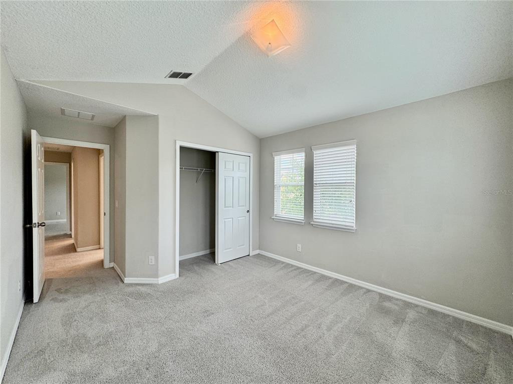 8620 Wellington Blue Lane Windermere, FL 34786 - Photo 17 of 22 a view of an empty room with closet and a window