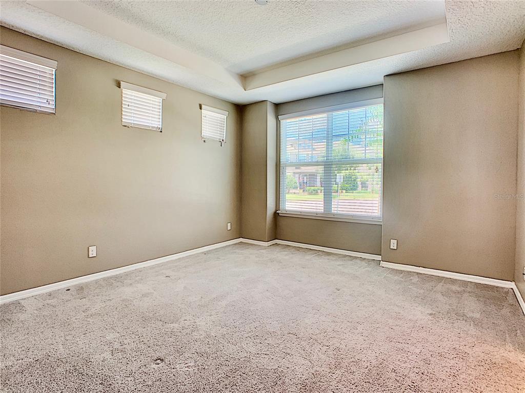 8620 Wellington Blue Lane Windermere, FL 34786 - Photo 10 of 22 a view of an empty room with a window