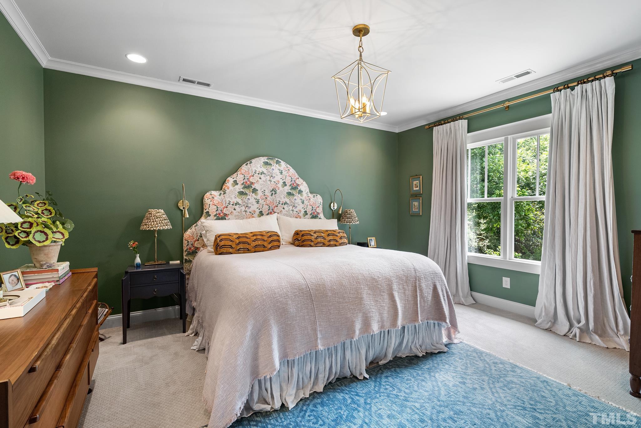 1841 Reaves Drive Raleigh, NC 27608 - Photo 18 of 25 a bedroom with a bed and a window