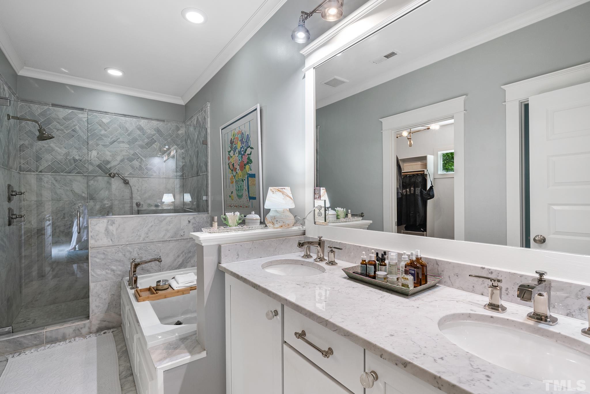 1841 Reaves Drive Raleigh, NC 27608 - Photo 19 of 25 a bathroom with a sink double vanity and mirror