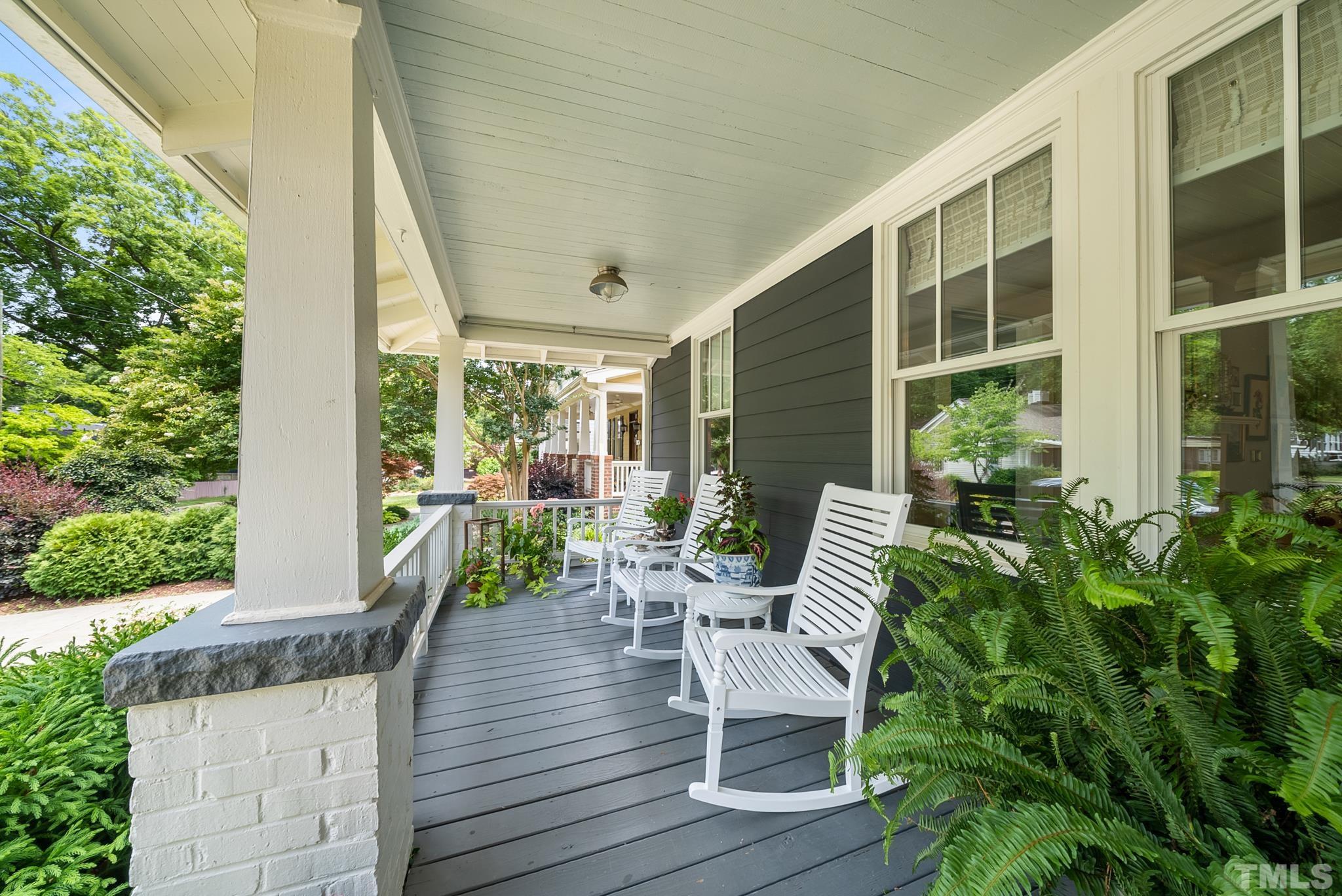 1841 Reaves Drive Raleigh, NC 27608 - Photo 2 of 25 a view of a chair and tables in the balcony