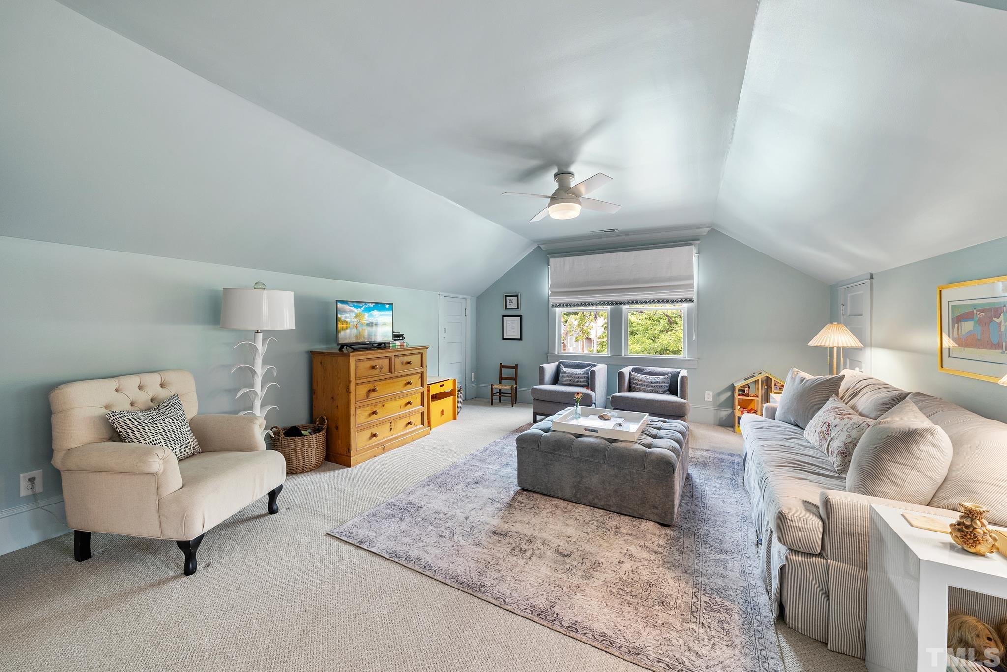 1841 Reaves Drive Raleigh, NC 27608 - Photo 21 of 25 a bedroom with furniture and a couch