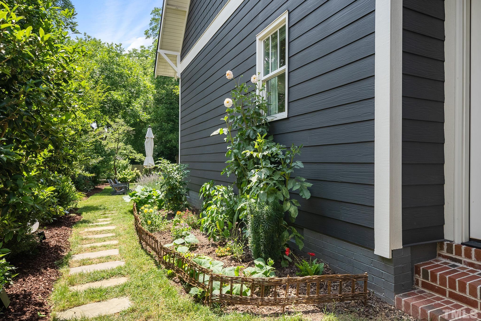 1841 Reaves Drive Raleigh, NC 27608 - Photo 23 of 25 a view of a house with potted plants