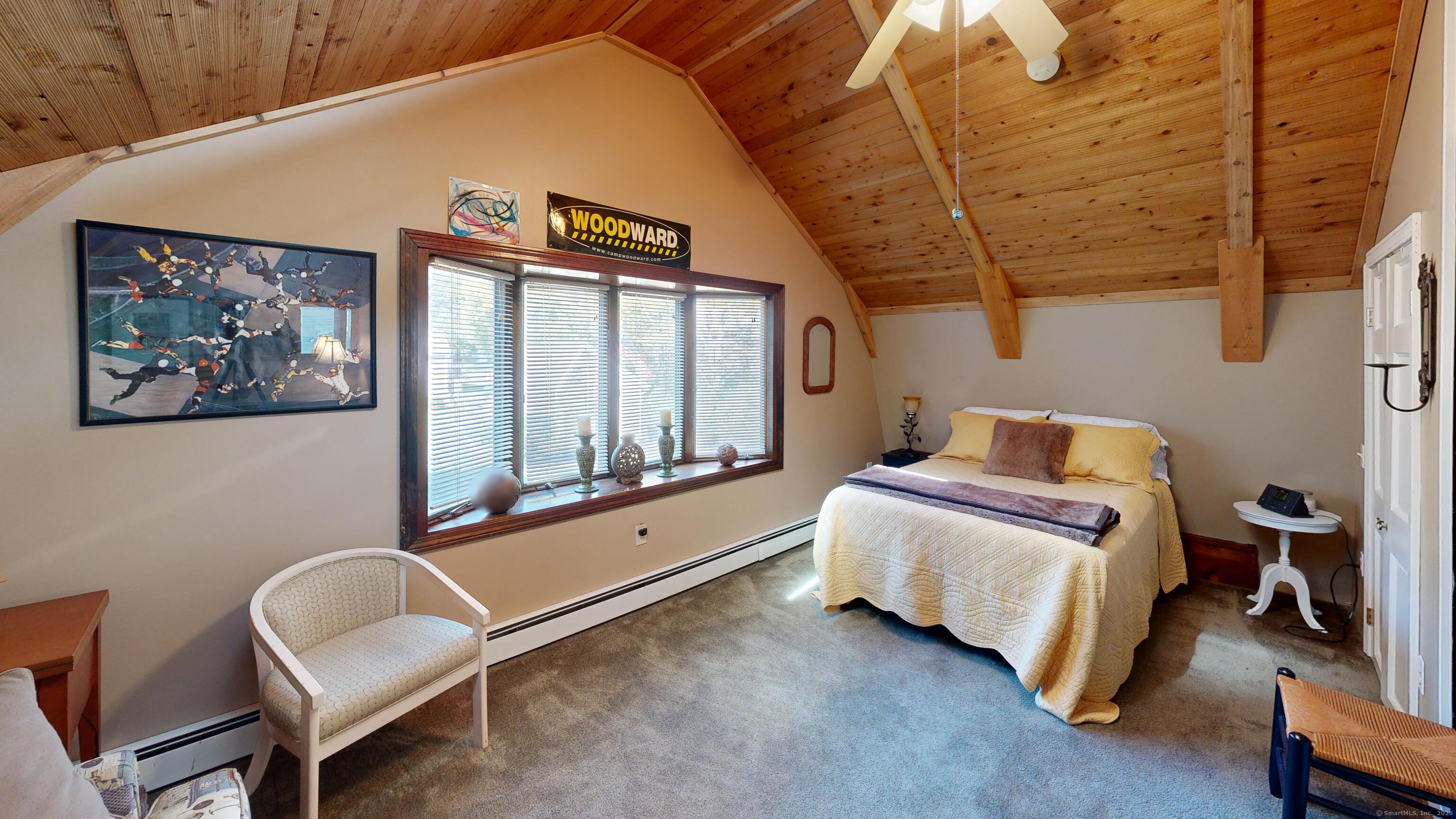 214 Mountain Road Cheshire, CT 06410 - Photo 26 of 40 a room with a bed and a chair