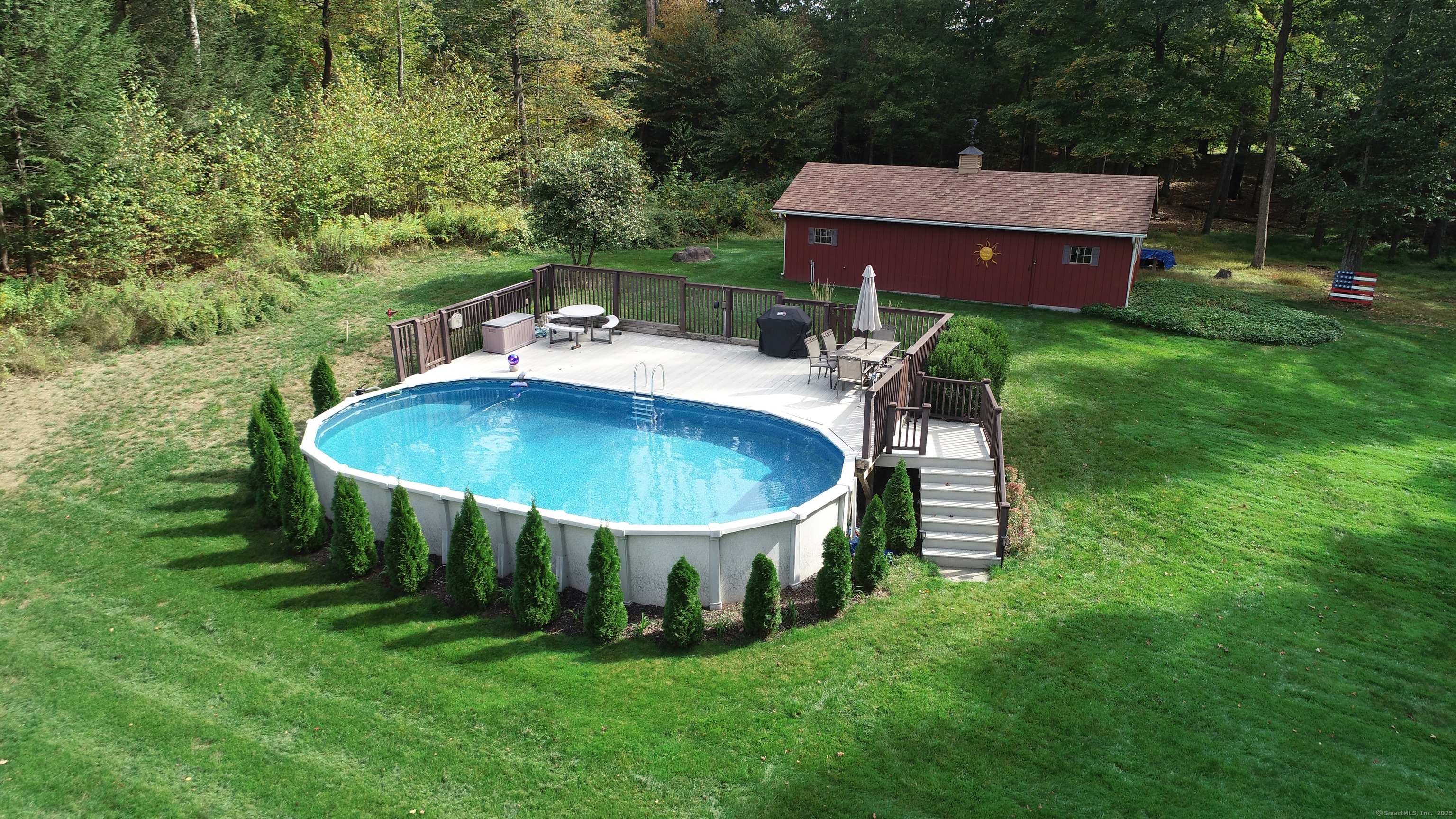 214 Mountain Road Cheshire, CT 06410 - Photo 31 of 40 a view of a chairs and table in the garden
