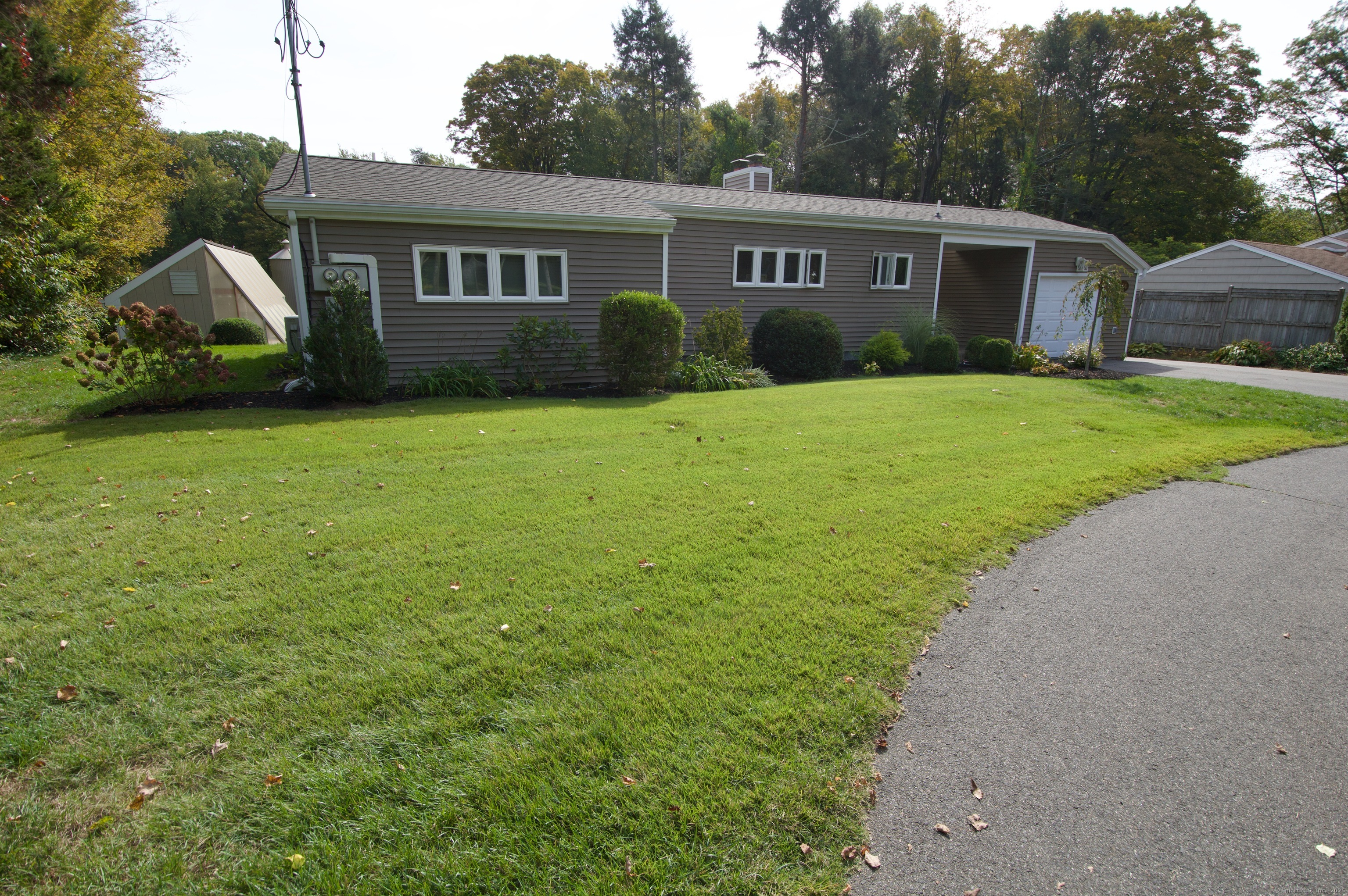 214 Mountain Road Cheshire, CT 06410 - Photo 33 of 40 a view of a yard in front of a house