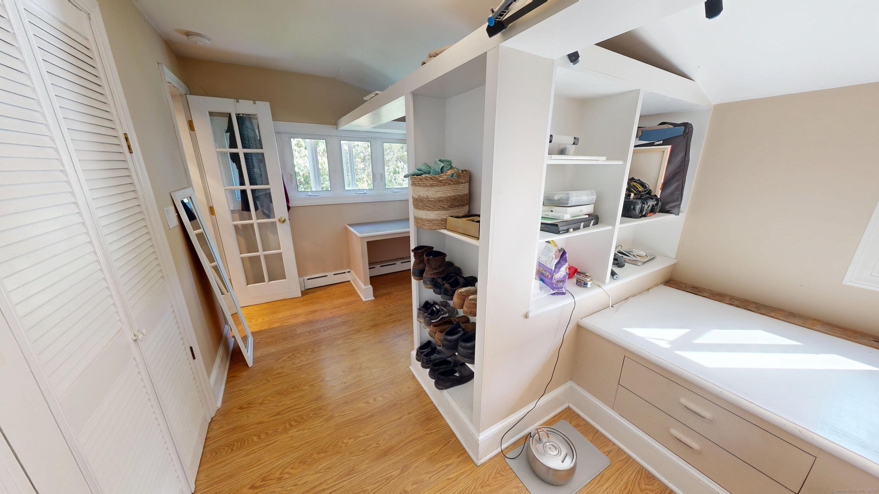 214 Mountain Road Cheshire, CT 06410 - Photo 38 of 40 a hallway with white cabinets washer and dryer