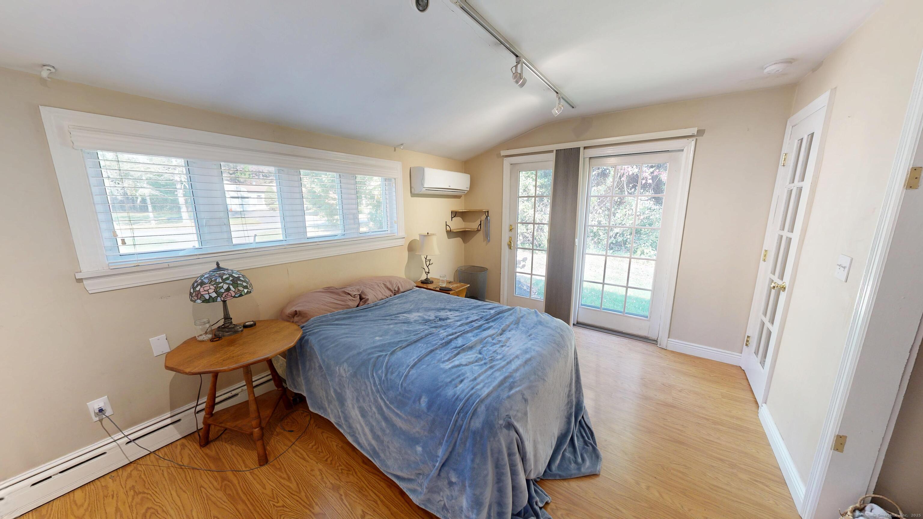 214 Mountain Road Cheshire, CT 06410 - Photo 39 of 40 a bedroom with a bed and a table