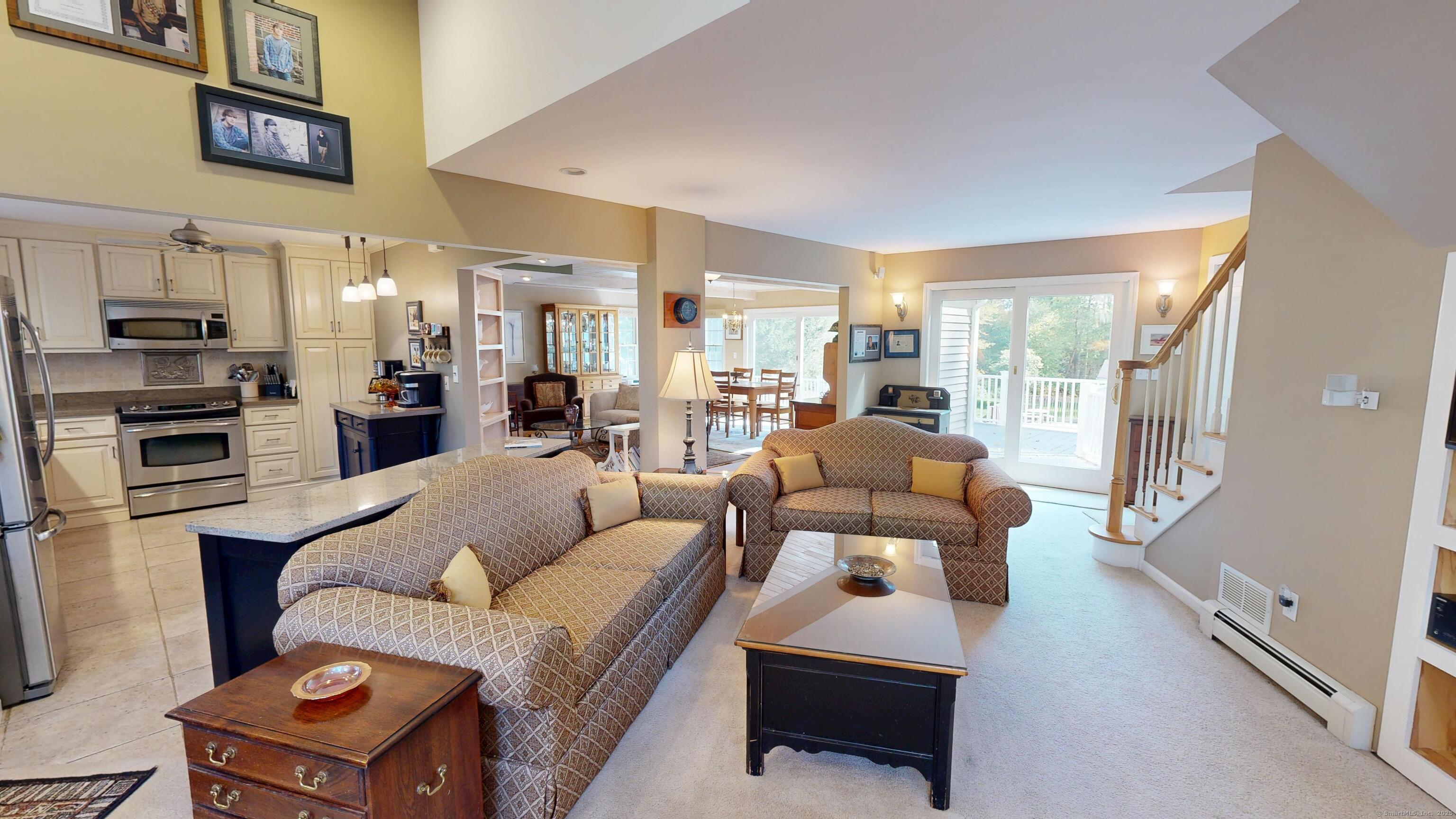 214 Mountain Road Cheshire, CT 06410 - Photo 5 of 40 a living room with furniture and a kitchen view