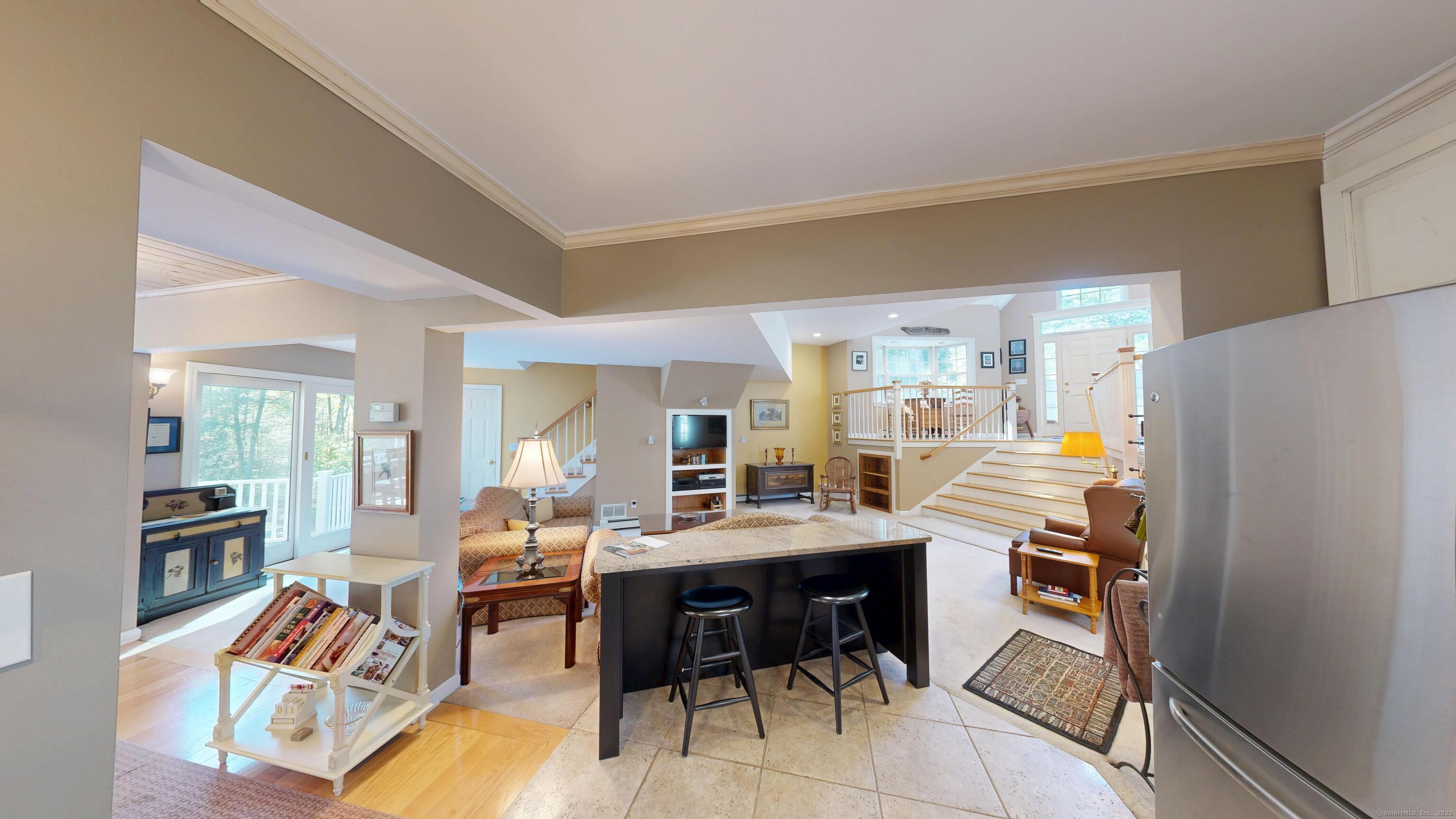 214 Mountain Road Cheshire, CT 06410 - Photo 10 of 40 a room with stainless steel appliances kitchen island granite countertop furniture and a view of kitchen