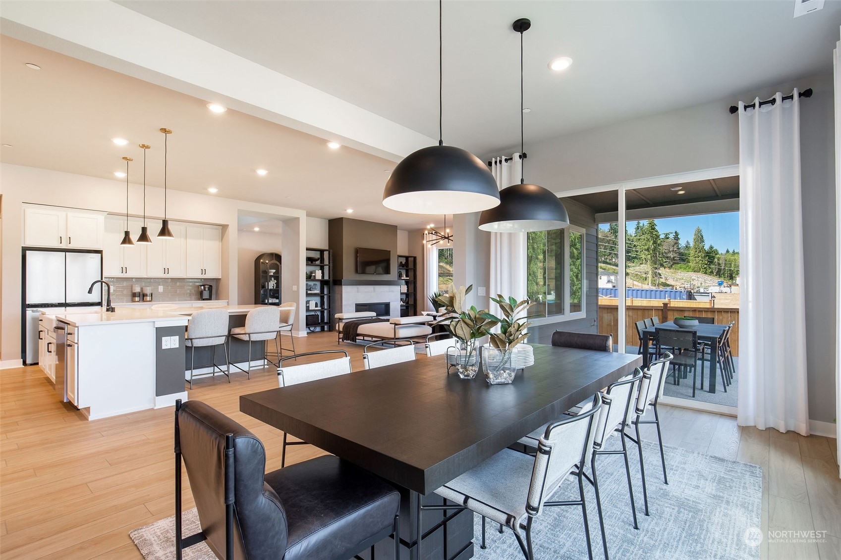 2575 Union Avenue Northeast, Unit 25 Renton, WA 98059 - Photo 5 of 21 an open kitchen with dining table and chairs
