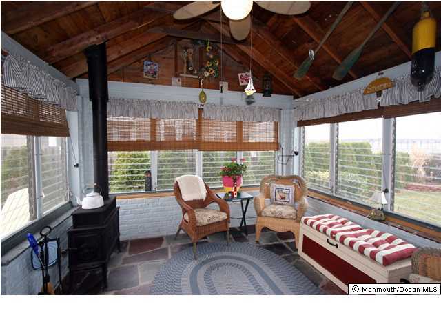 1207 River Road Belmar, NJ 07719 - Photo 3 of 3 a living room with furniture and a large window