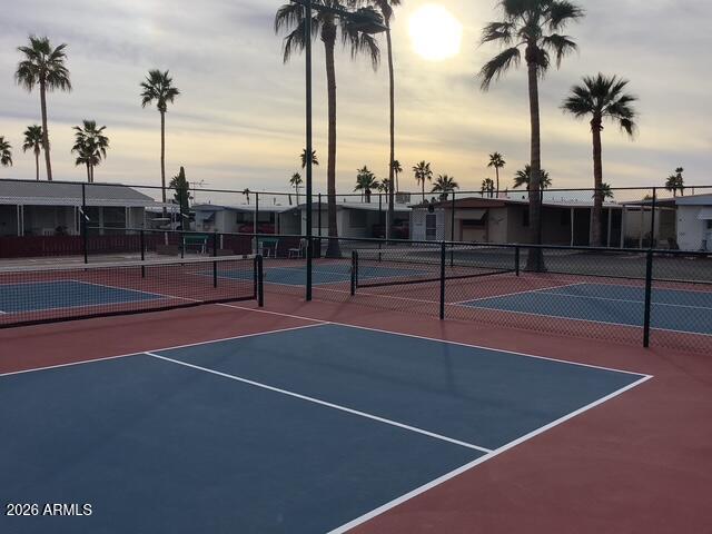 2605 South Tomahawk Road, Unit 10 Apache Junction, AZ 85119 - Photo 17 of 22 a view of a tennis court with palm trees