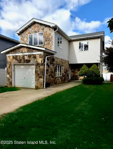 a front view of building with yard