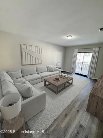 a living room with furniture and a rug