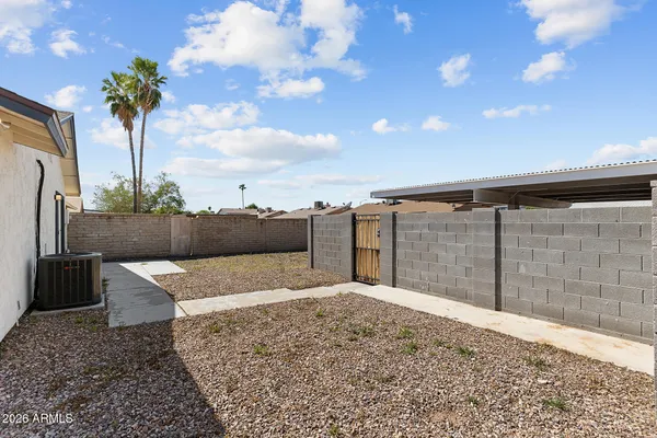 a house view with a backyard space