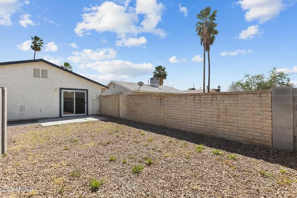 a view of a backyard of the house